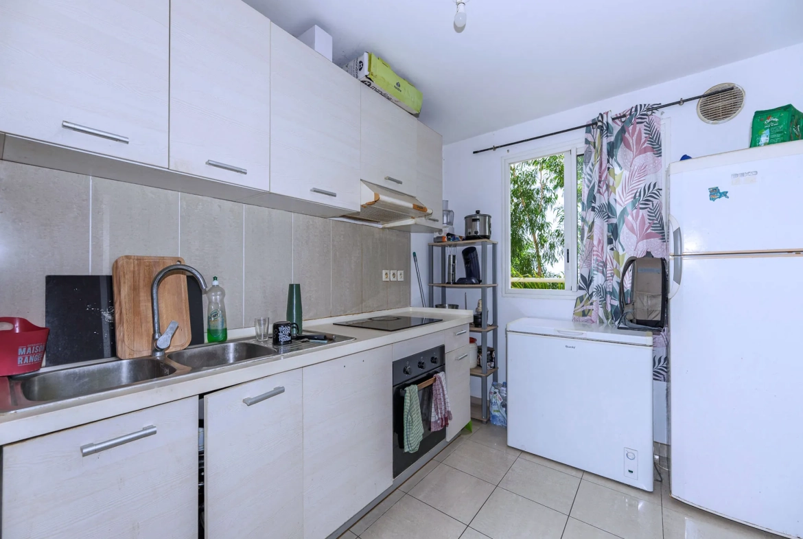 Appartement T2 avec varangue et parking à Sainte Clotilde - Résidence de 2013 