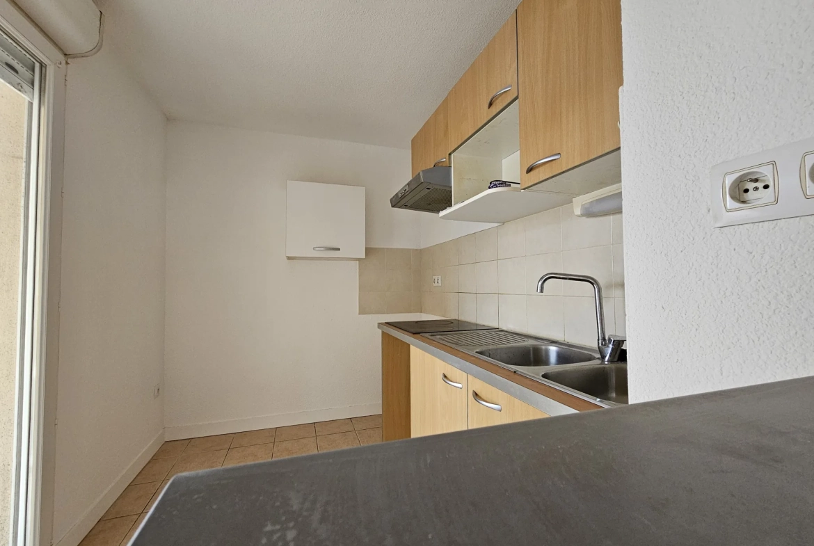Appartement T3 en rez-de-chaussée avec balcon et parking à Carcassonne 