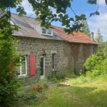 Maison de village en pierre avec jardin et garage à Le Tronchet - Opportunité à saisir
