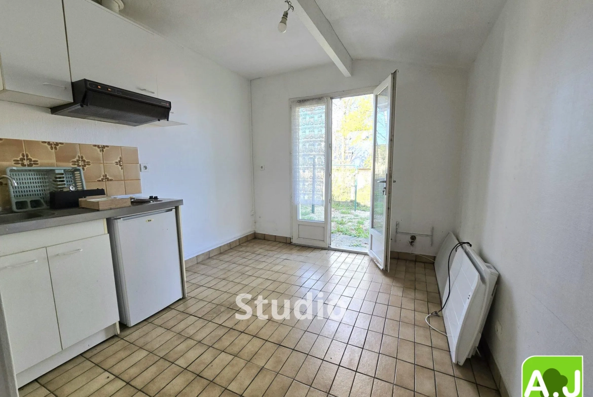 Ensemble immobilier avec maison et studio à Gravigny, emplacement idéal 