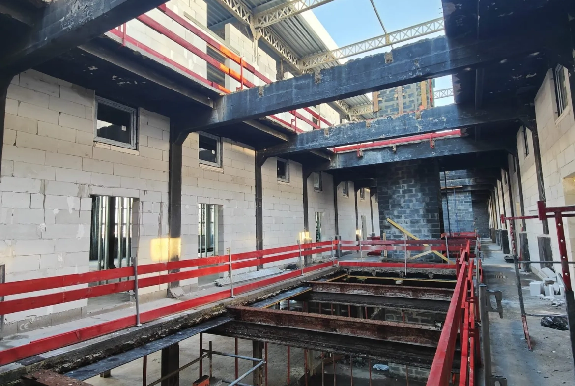 Loft brut à aménager dans la Lainière Résidence à Roubaix 