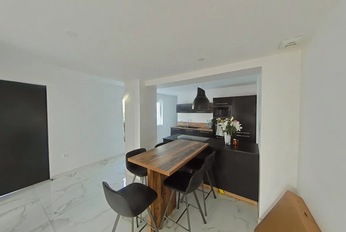 Maison à vendre à Oignies avec jardin, deux chambres et parking sécurisé 
