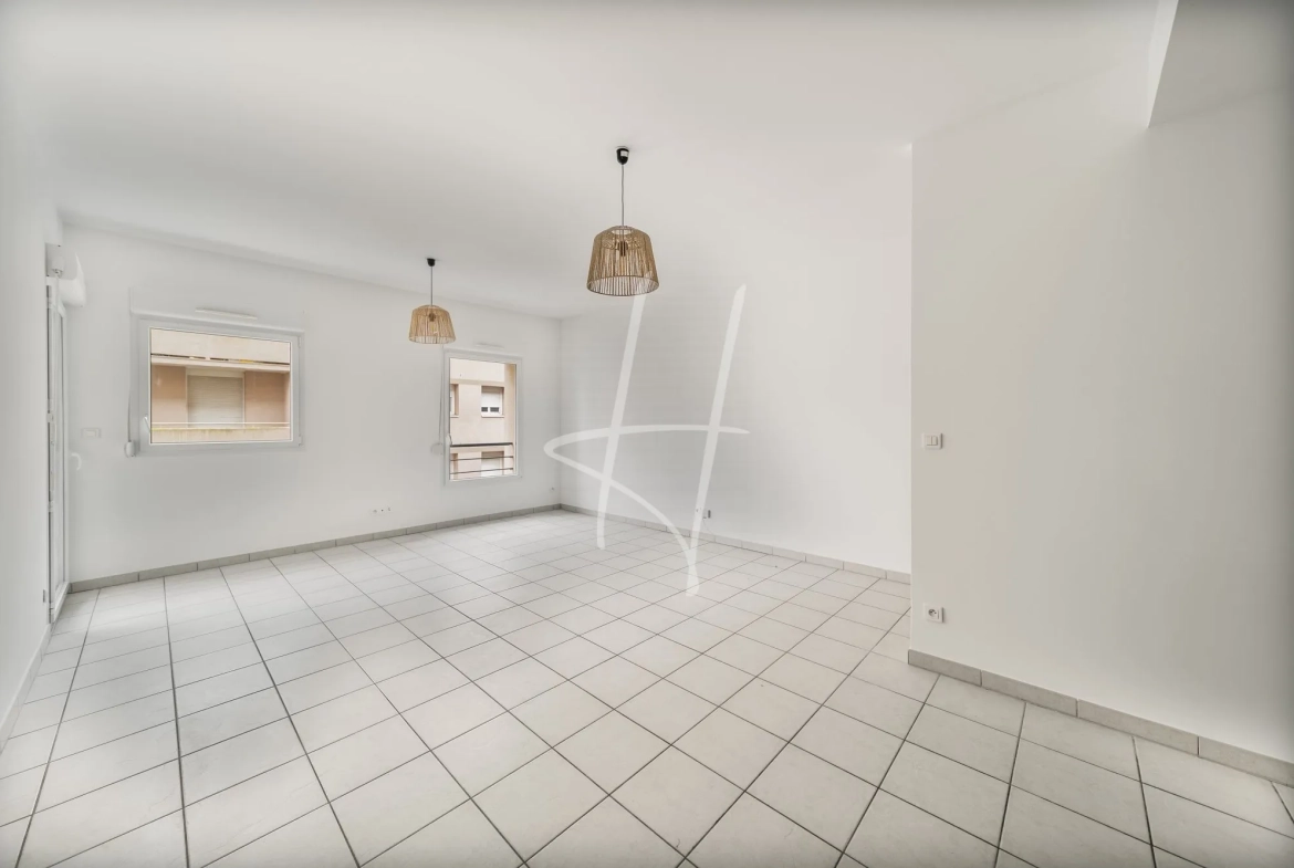Appartement F2 à Thionville de 52,75 m² avec balcon, parking sécurisé, loué, idéal investisseur 
