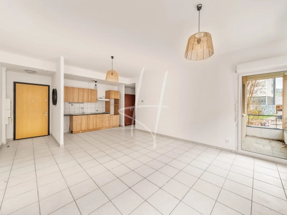 Appartement F2 à Thionville de 52,75 m² avec balcon, parking sécurisé, loué, idéal investisseur
