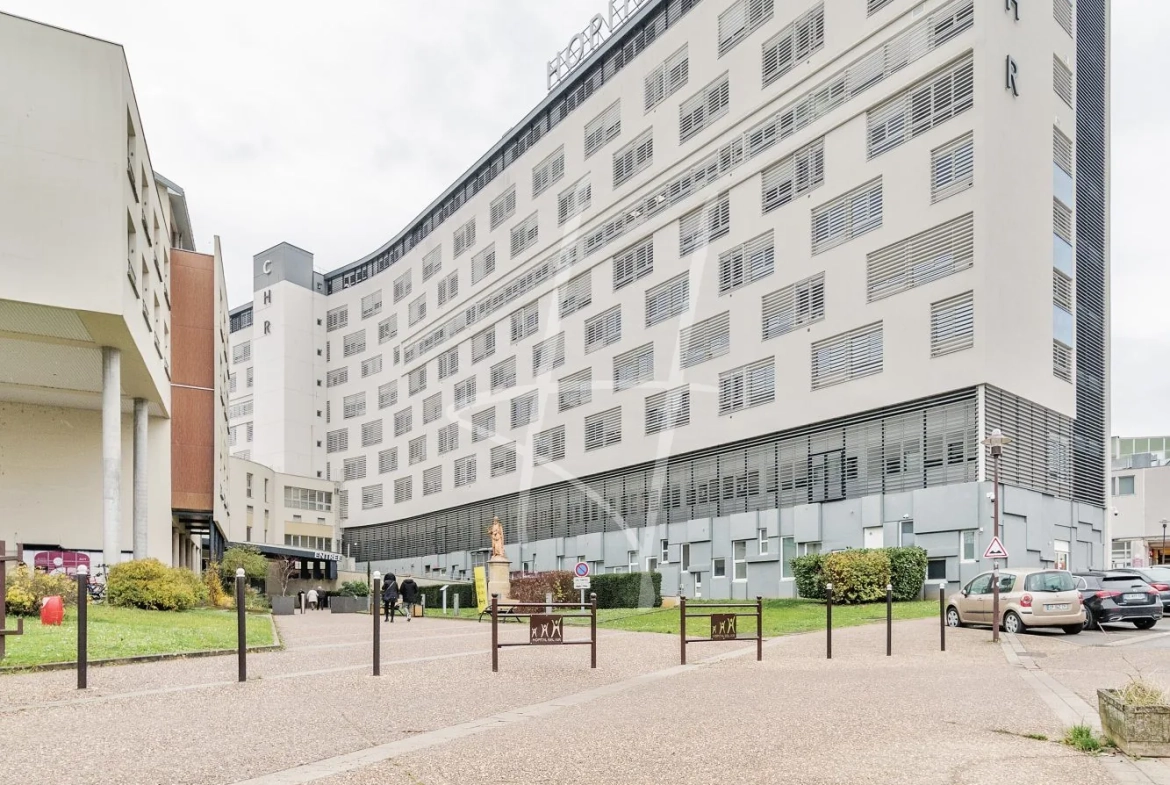Appartement F2 à Thionville de 52,75 m² avec balcon, parking sécurisé, loué, idéal investisseur 
