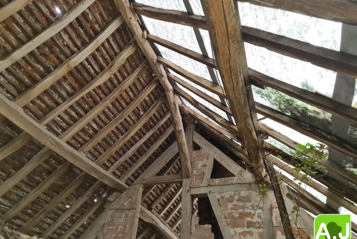 Maison à restaurer au centre-ville de Saint-André-de-l'Eure avec potentiel et terrain clos 