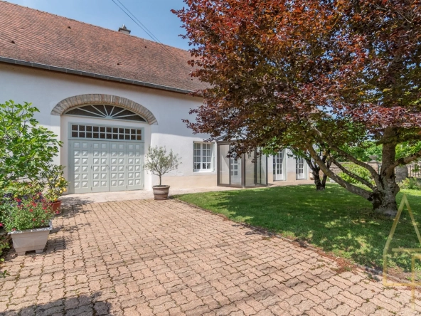 Maison à vendre à Lalheue avec jardin paysagé et grand potentiel d'extension