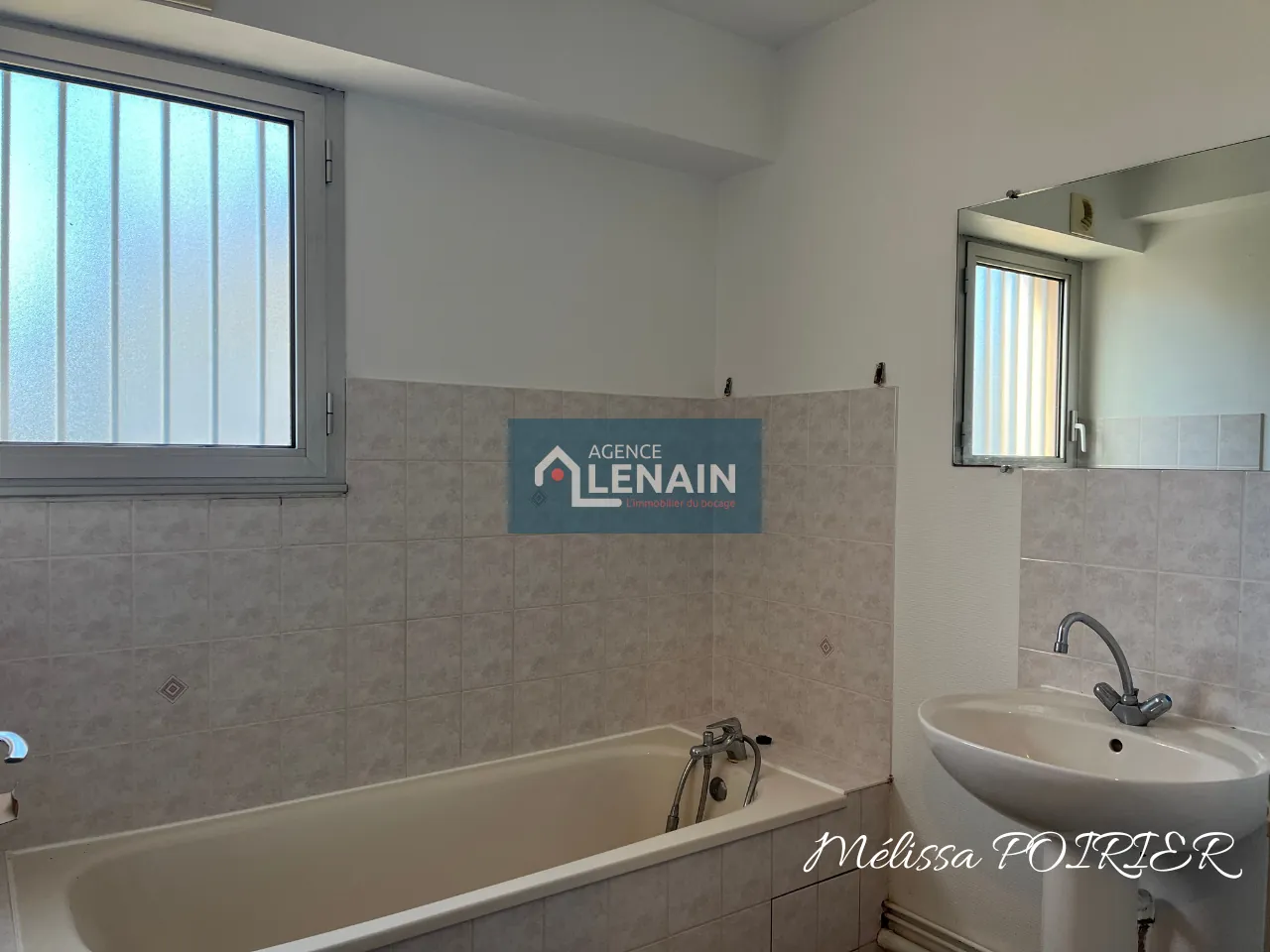 Appartement 4 Pièces avec Balcon, Parking et Cave à Cholet 