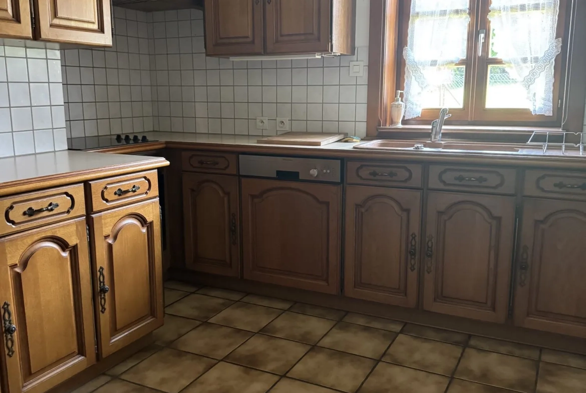 Maison mitoyenne alsacienne à Hermerswiller de 88 m² avec garage et cheminée 