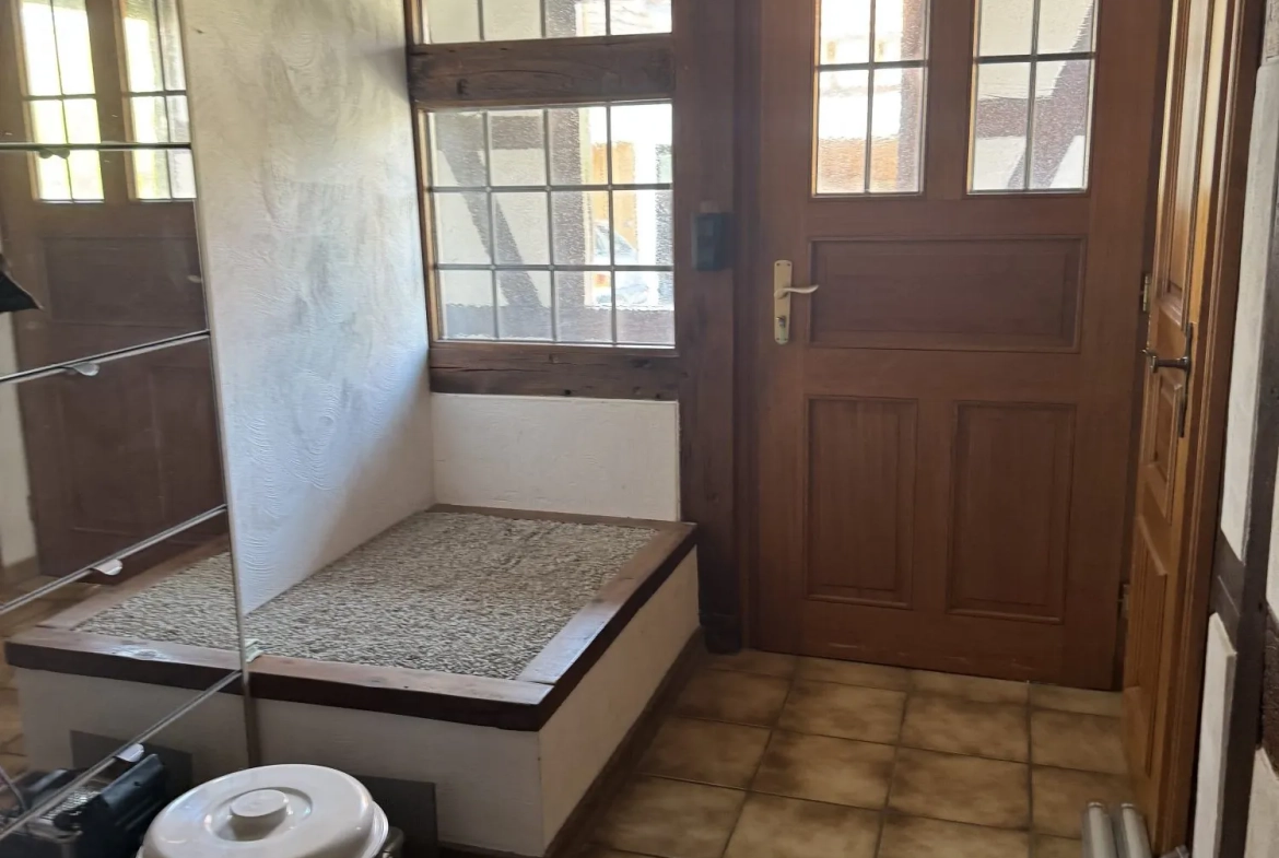 entrée avec sas Maison mitoyenne alsacienne à Hermerswiller de 88 m² avec garage et cheminée 