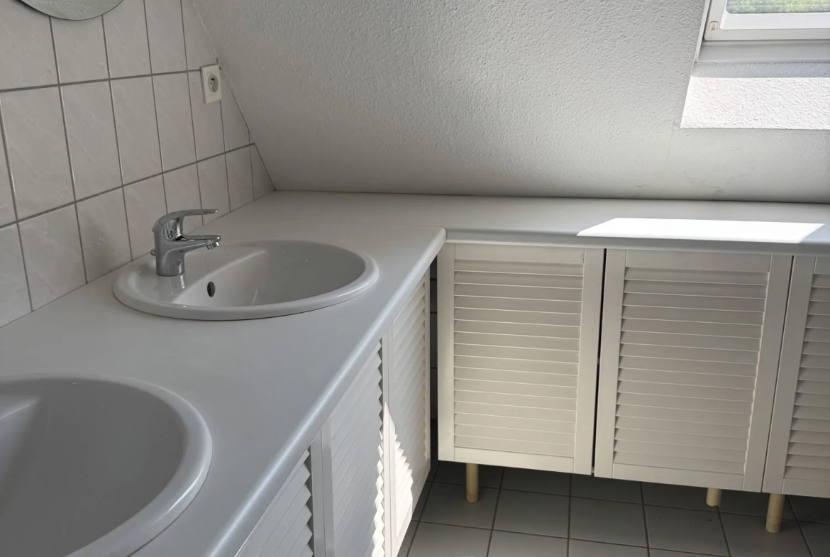 Maison mitoyenne alsacienne à Hermerswiller de 88 m² avec garage et cheminée 