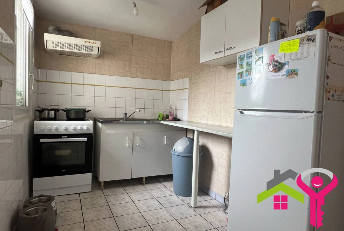 Immeuble de rapport à Douchy-les-Mines avec maison et local commercial à vendre 