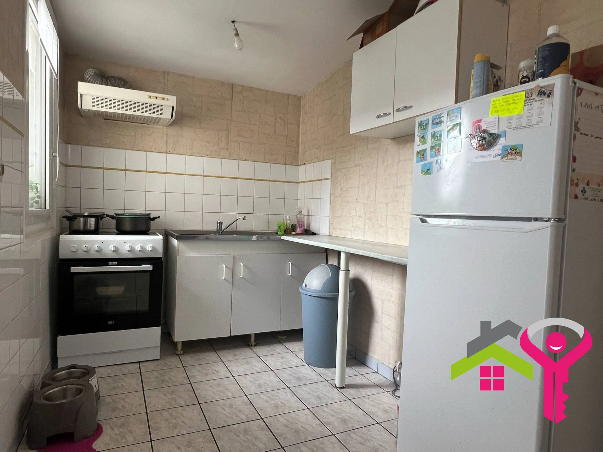 Immeuble de rapport à Douchy-les-Mines avec maison et local commercial à vendre 