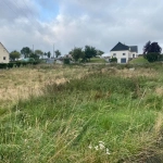 Grand terrain constructible à vendre à Esson, vue exceptionnelle sur la Suisse Normande
