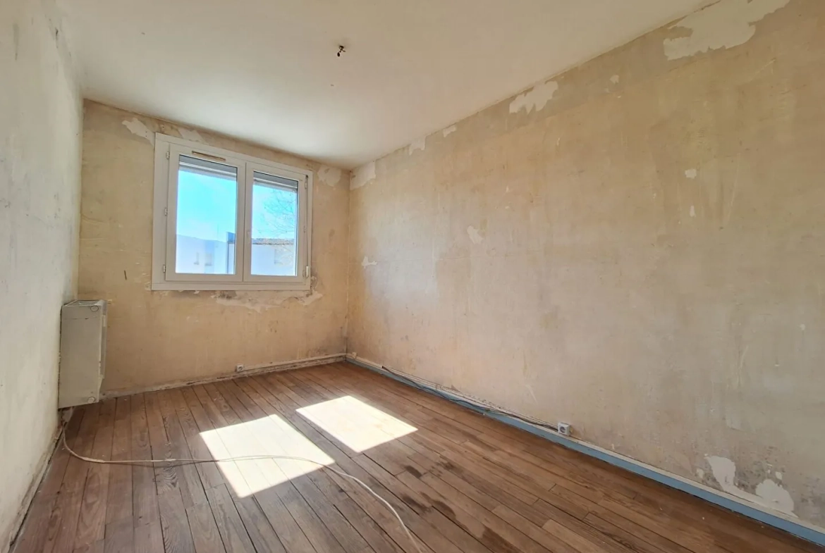 Appartement à Epinal de 4 pièces, 70 m² à rénover avec garage et cave 