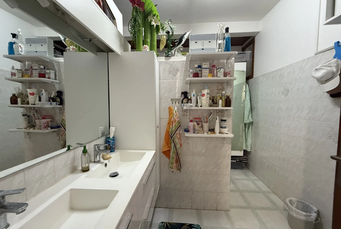 Appartement F3 à vendre à Ducos avec jardin, 2 chambres, terrasse et stationnement sécurisé 