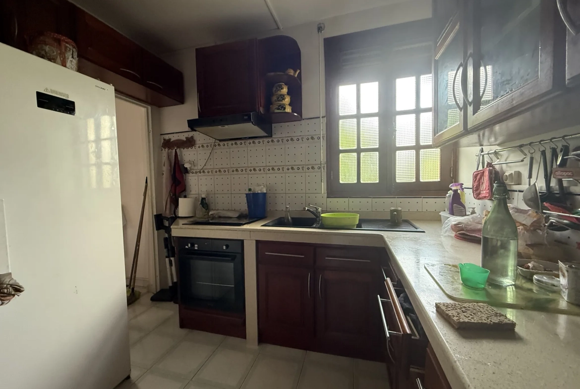 Appartement F3 à vendre à Ducos avec jardin, 2 chambres, terrasse et stationnement sécurisé 