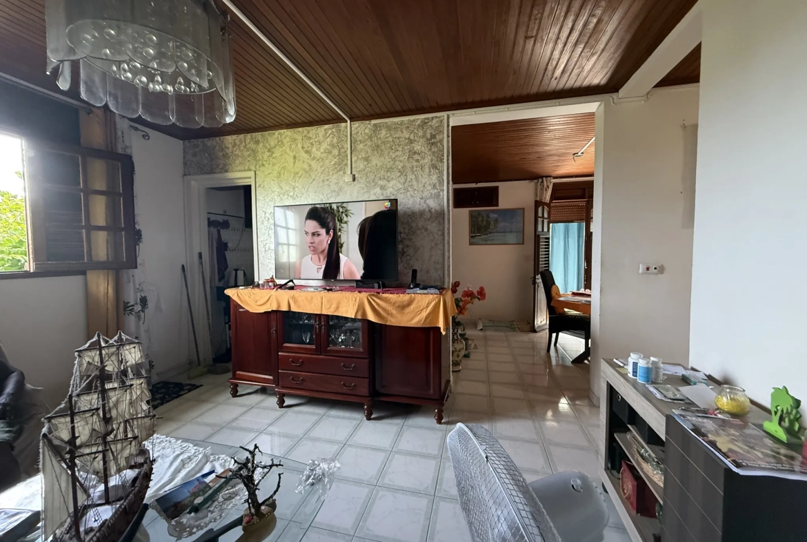 Appartement F3 à vendre à Ducos avec jardin, 2 chambres, terrasse et stationnement sécurisé 