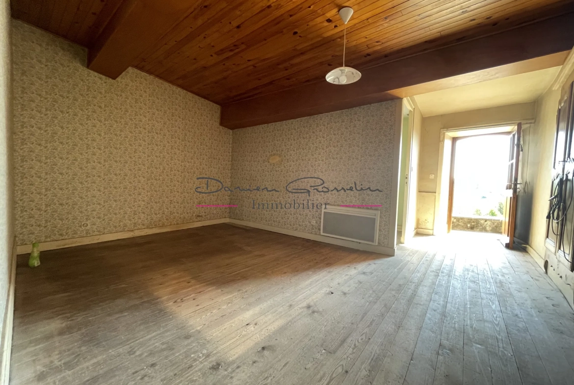 Maison de village à Thizy avec jardin et garage - Opportunité à rénover 