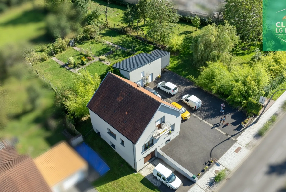 Maison 140 m² à Farébersviller avec terrasse, grands garages et jardin 