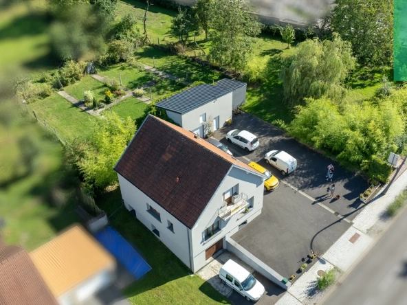 Maison 140 m² à Farébersviller avec terrasse, grands garages et jardin 
