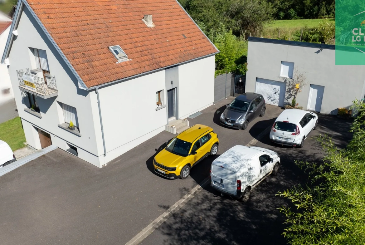 Maison 140 m² à Farébersviller avec terrasse, grands garages et jardin 