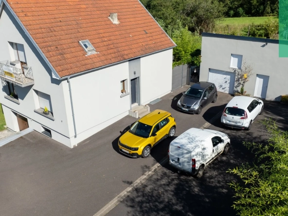 Maison 140 m² à Farébersviller avec terrasse, grands garages et jardin 
