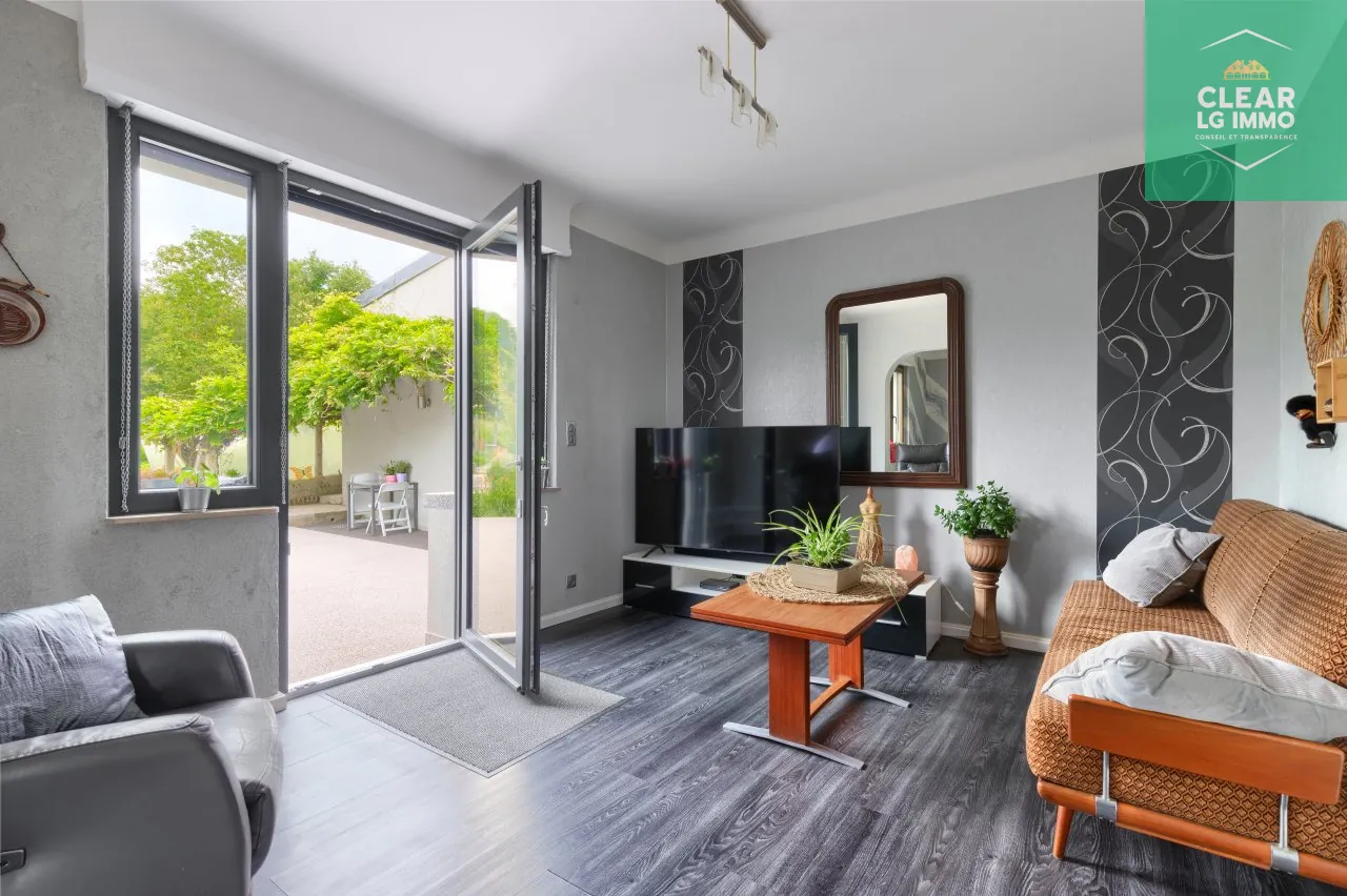 Maison 140 m² à Farébersviller avec terrasse, grands garages et jardin 