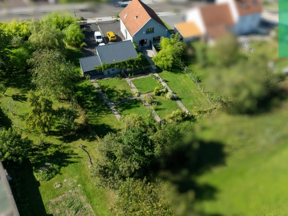 Maison 140 m² à Farébersviller avec terrasse, grands garages et jardin 