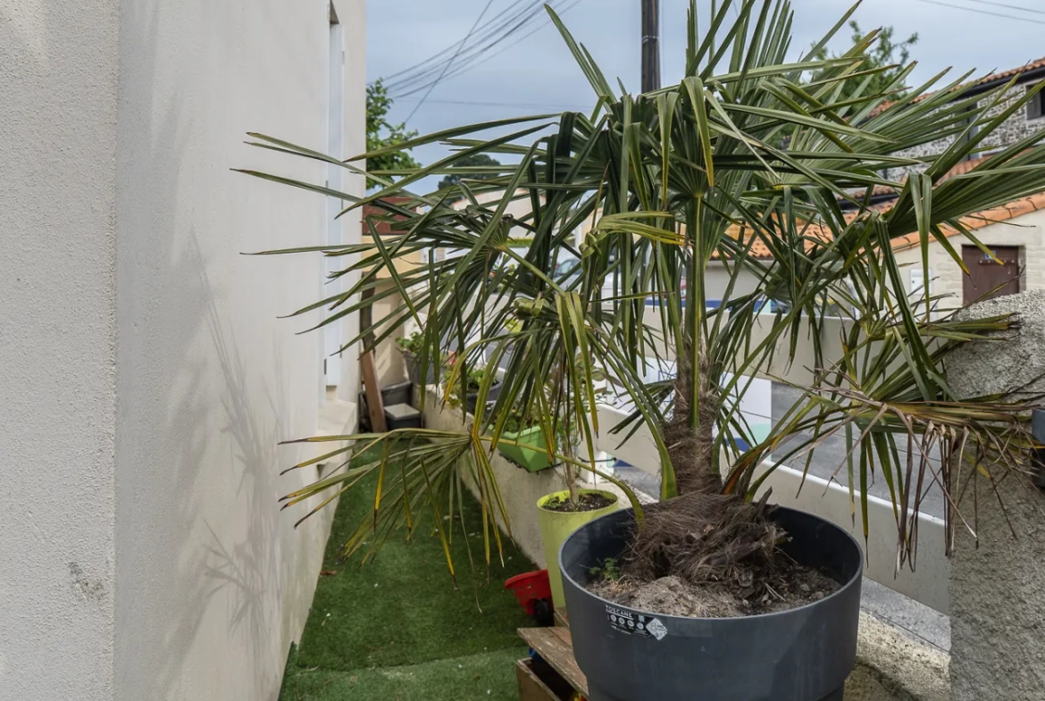 Maison familiale de 82 m² à Bouguenais avec jardin et proximité commodités 