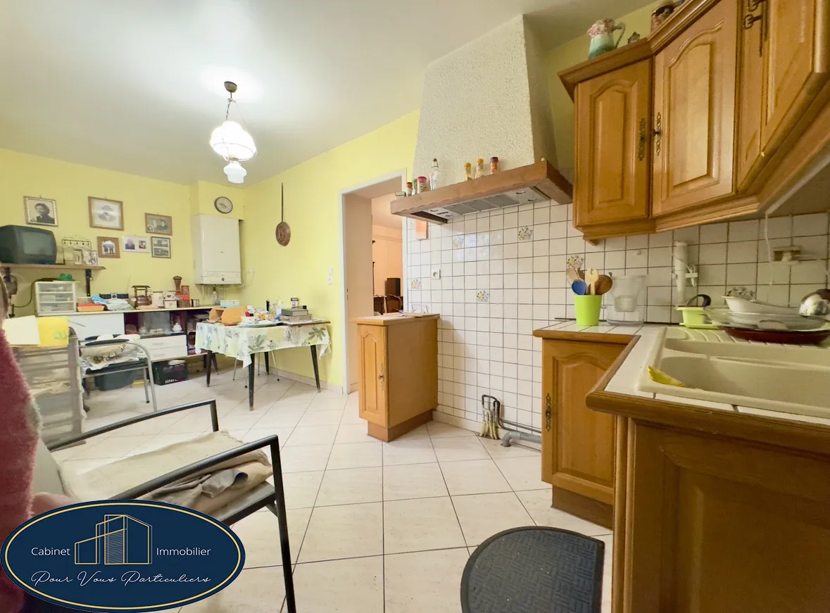 Maison mitoyenne à Haulchin de 73 m² - 2 chambres, cour et cave 
