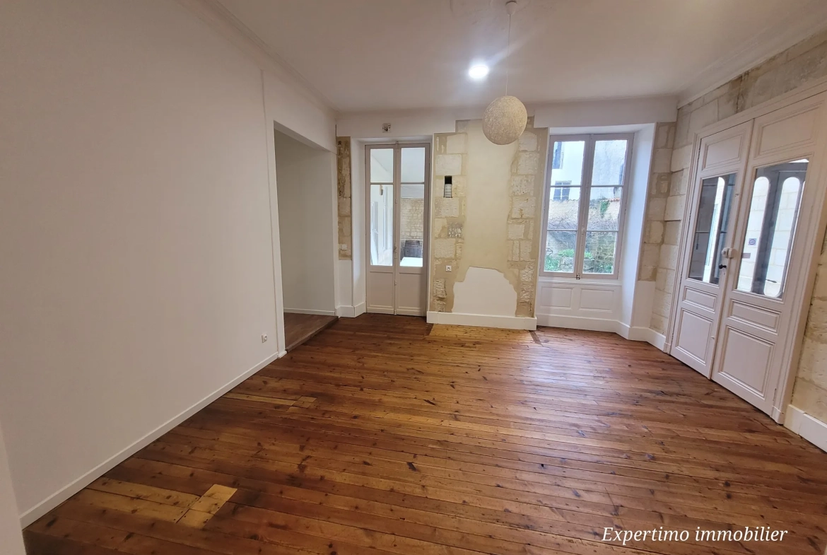 Appartement de 96,72 m² en plein centre de Jonzac avec terrasse et cour intérieure 