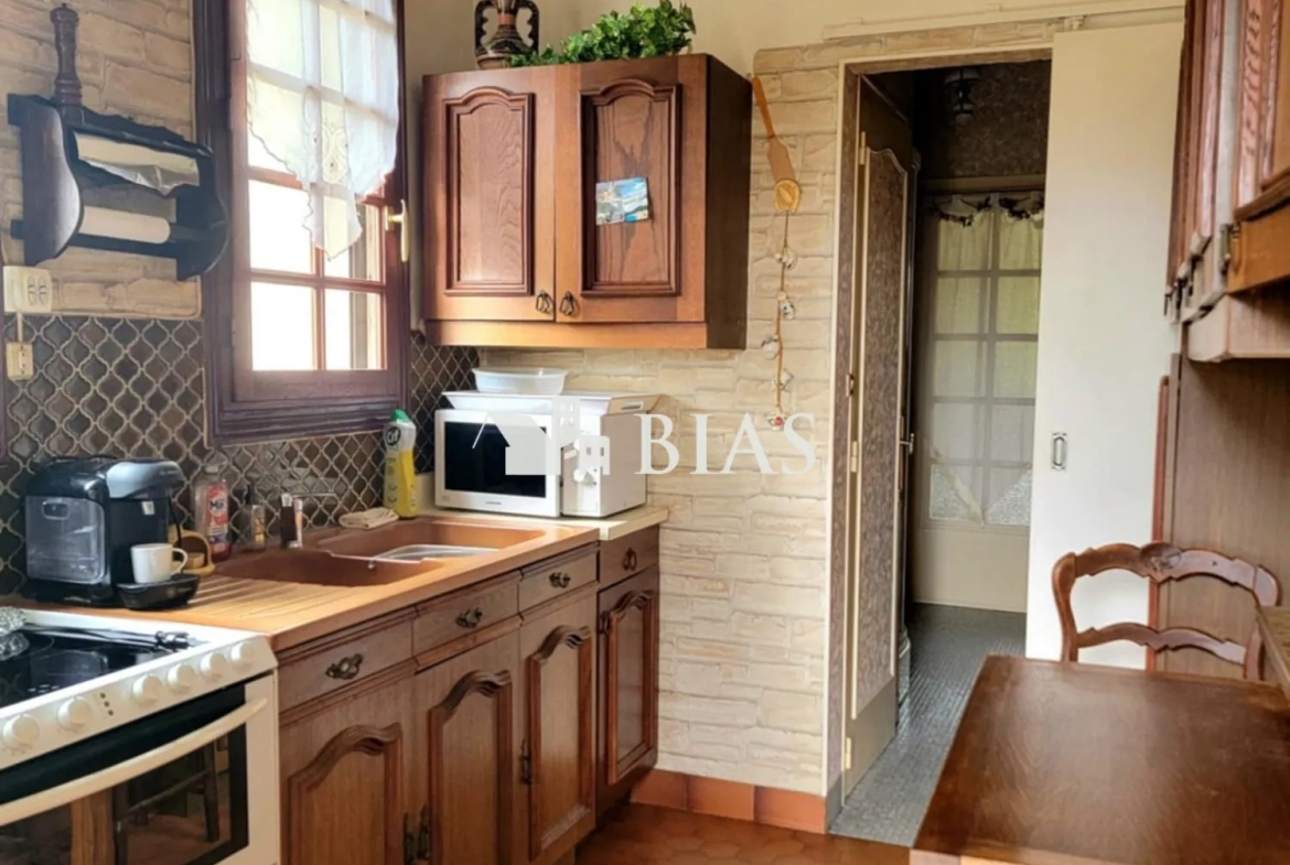 Maison à vendre au Trait avec jardin, garage et potentiel de rénovation 