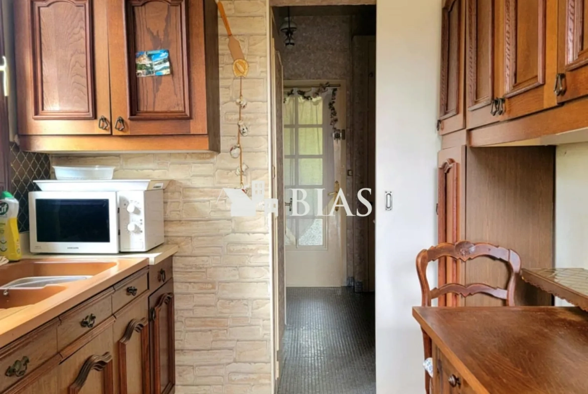 Maison à vendre au Trait avec jardin, garage et potentiel de rénovation 