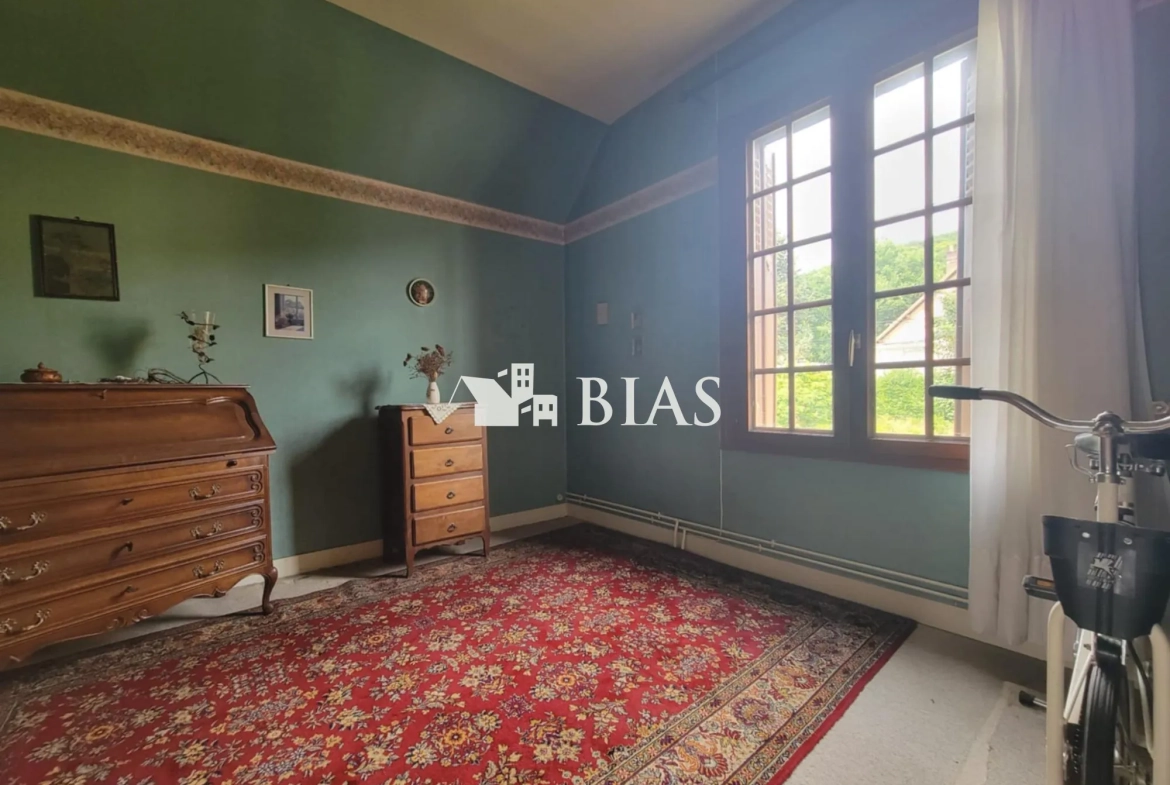 Maison à vendre au Trait avec jardin, garage et potentiel de rénovation 