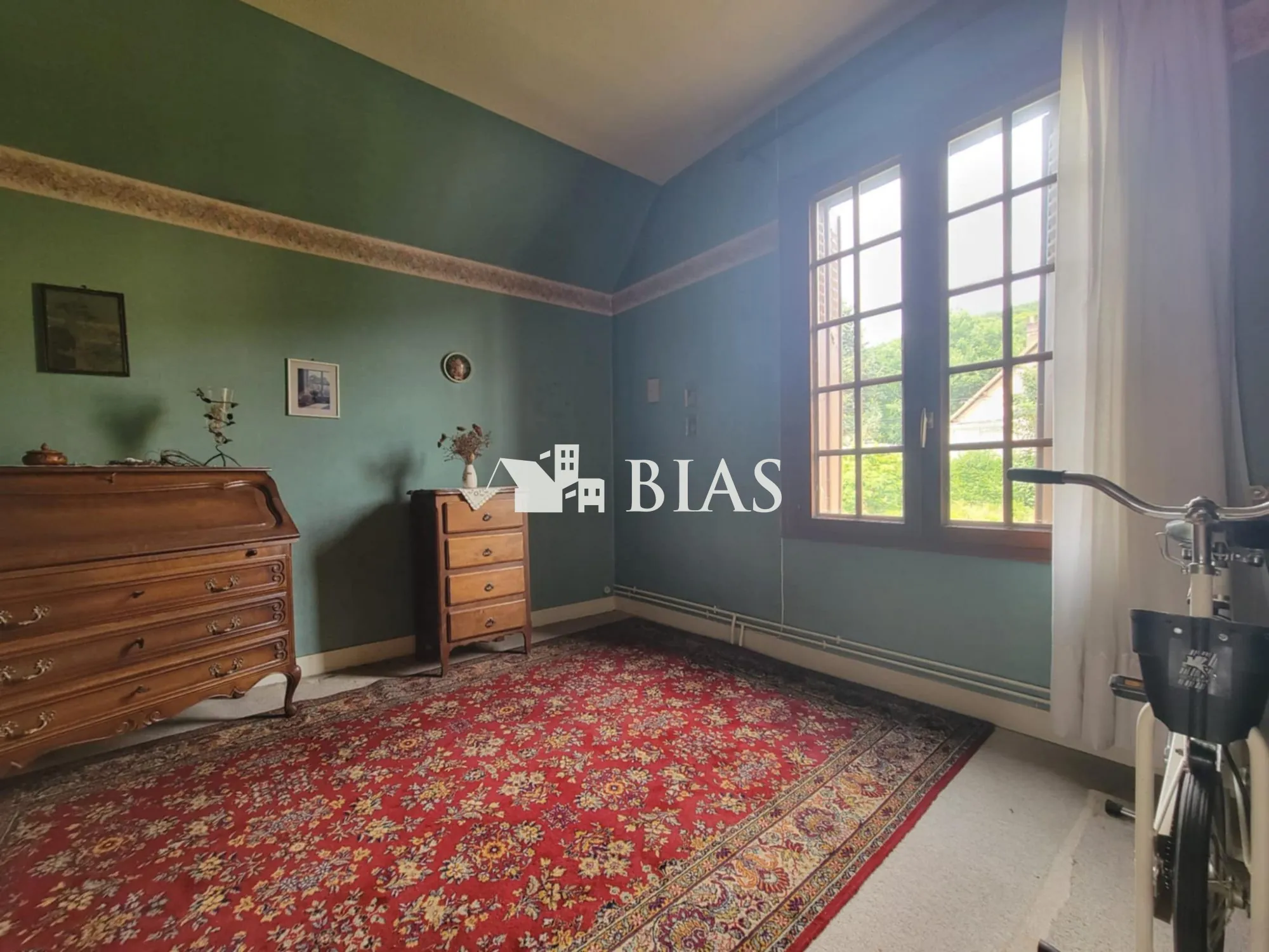 Maison à vendre au Trait avec jardin, garage et potentiel de rénovation 