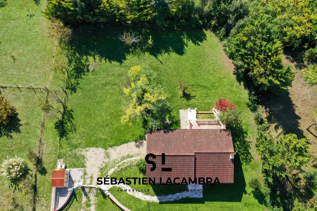 Maison familiale avec vue panoramique et terrain arboré à Senouillac 