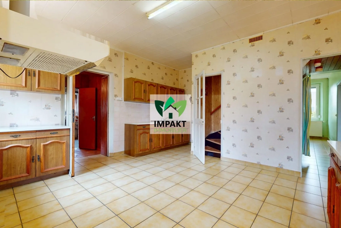 Maison ancienne à vendre à Champagney avec jardin et potentiel de rénovation 