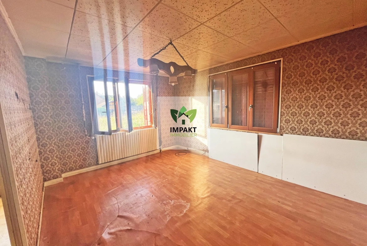 Maison à rénover avec grand garage et potentiel professionnel à Ronchamp 