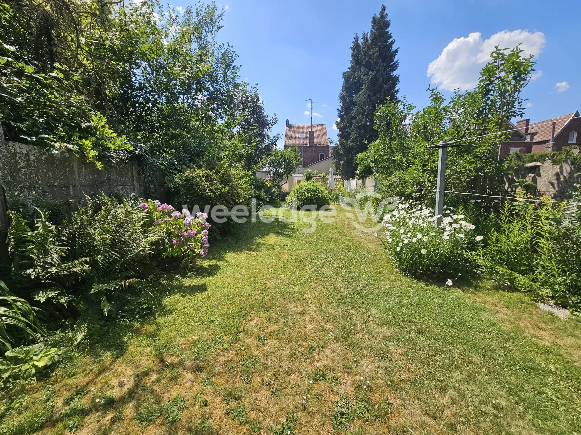 Maison individuelle à Onnaing avec grand potentiel et jardin clos 
