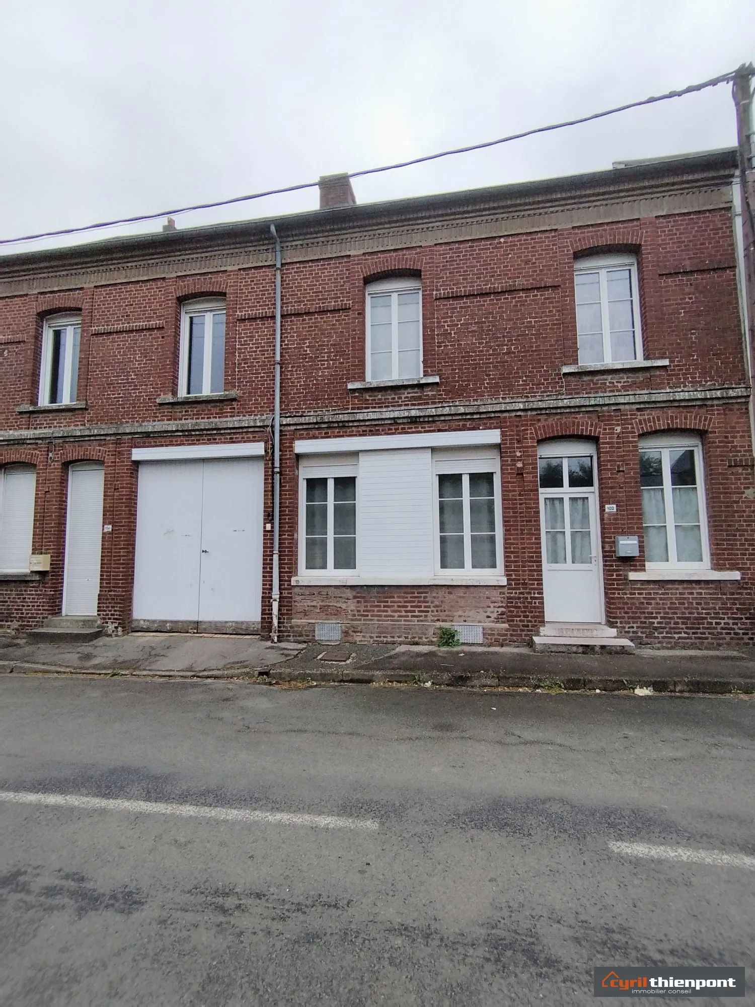 Charmante maison de ville à Friville-Escarbotin avec garage, jardin et potentiel de rénovation 