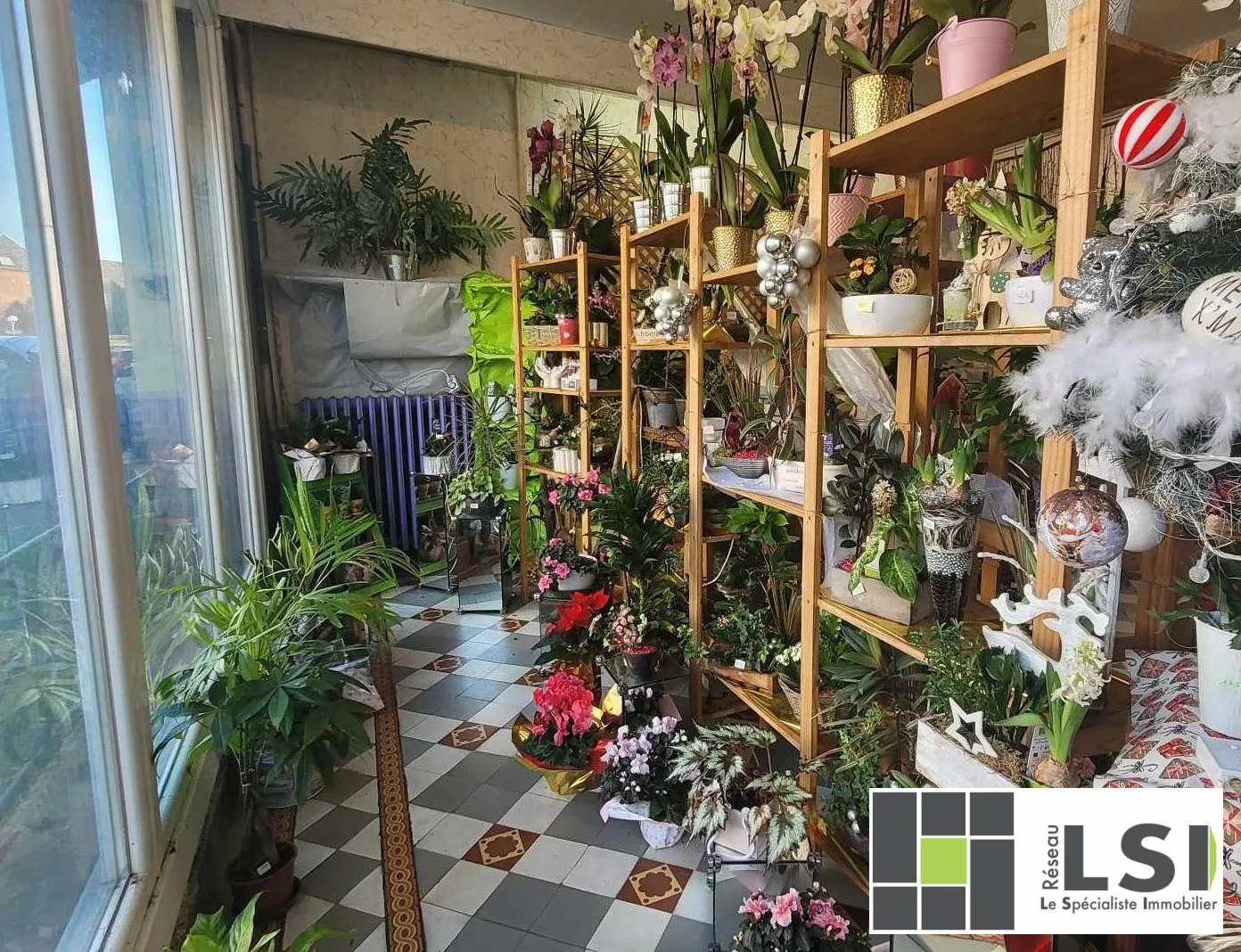 Immeuble mixte avec local commercial et habitation au centre du Nouvion-en-Thiérache 