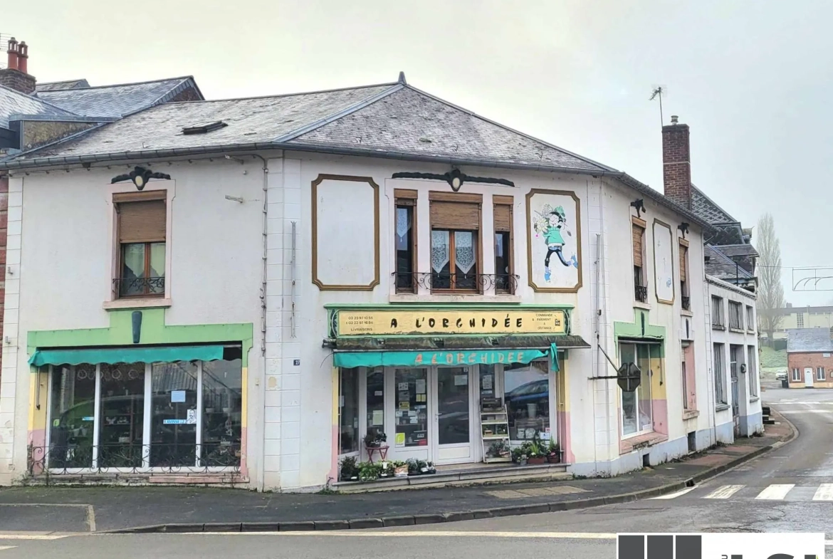 Immeuble mixte avec local commercial et habitation au centre du Nouvion-en-Thiérache 