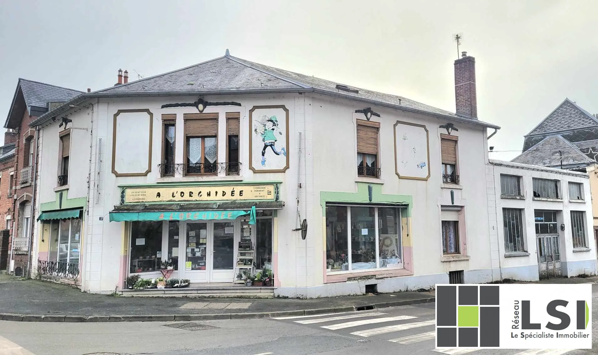 Immeuble mixte avec local commercial et habitation au centre du Nouvion-en-Thiérache 