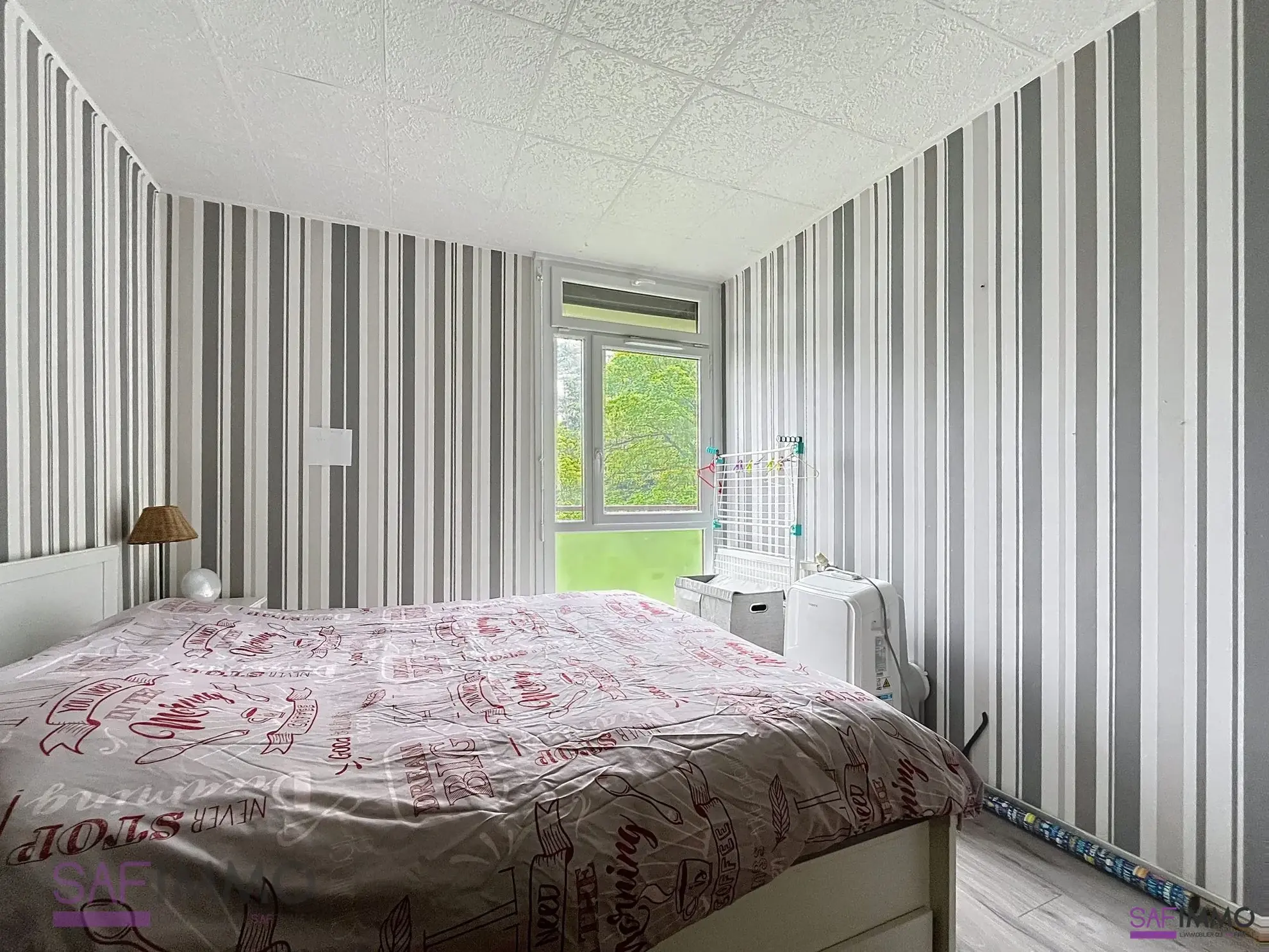 Appartement T4 lumineux à vendre à Oullins, rénové, avec balcon et cave dans environnement verdoyant 
