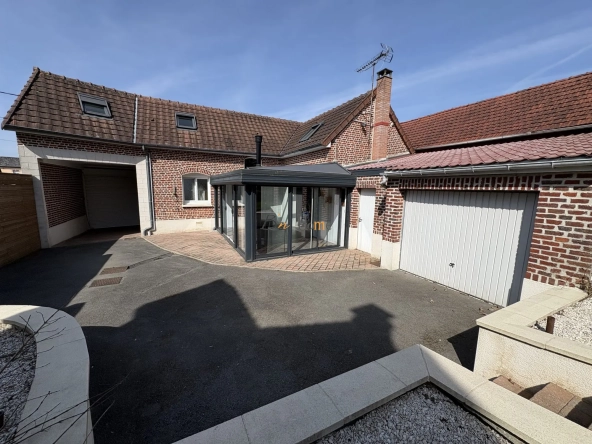 Charmante maison indépendante avec jardin à Puisieux - 3 chambres, garage et véranda lumineuse