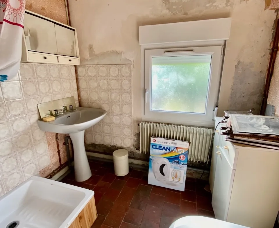 Maison chaleureuse avec garage, cave et terrain dans un village de l'Avesnois 