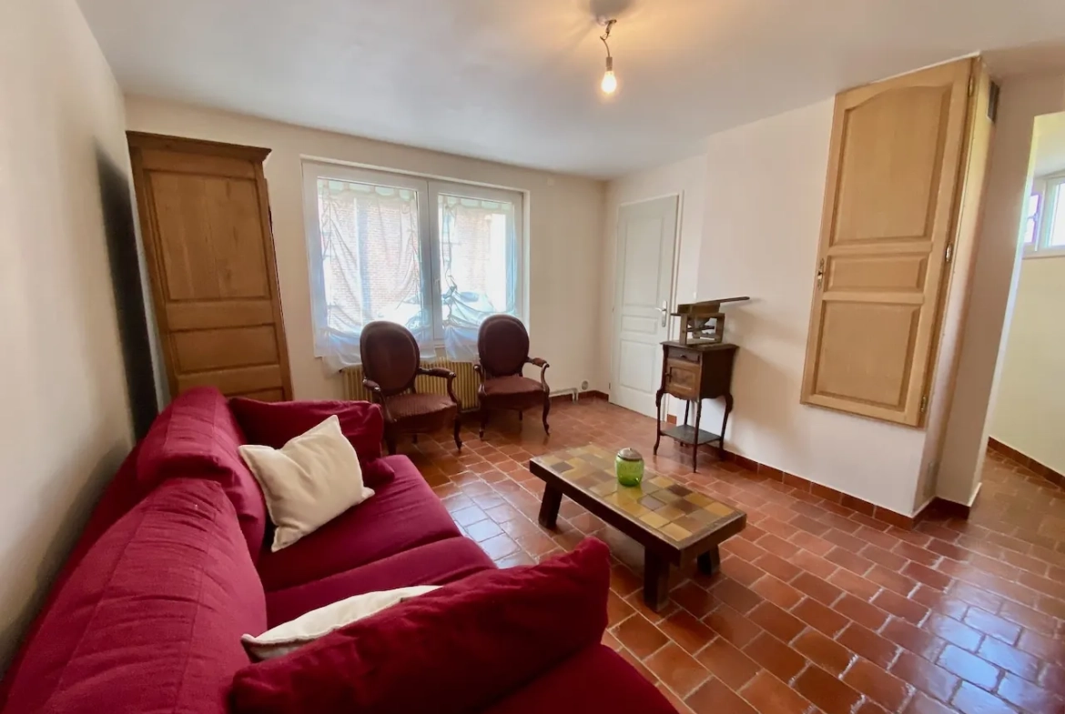 Maison chaleureuse avec garage, cave et terrain dans un village de l'Avesnois 