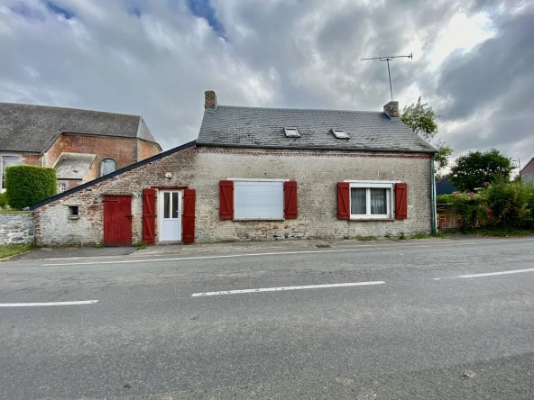 Maison chaleureuse avec garage, cave et terrain dans un village de l'Avesnois