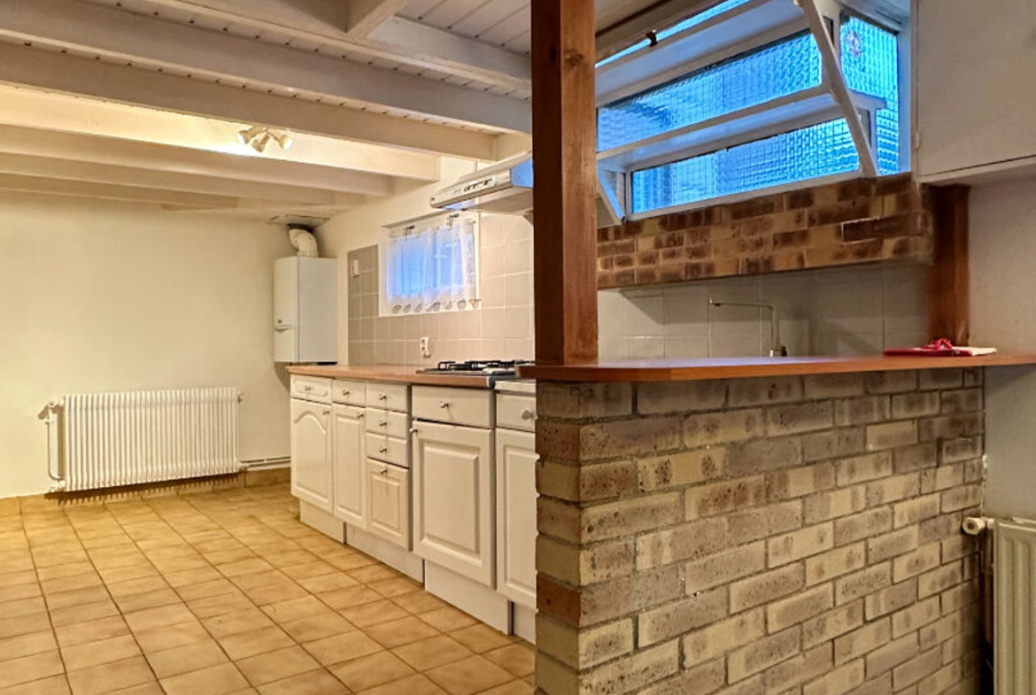 Maison 3 pièces 57 m² à Saint‑Brieuc – Quartier Robien, avec jardin constructible, garage et deux chambres.